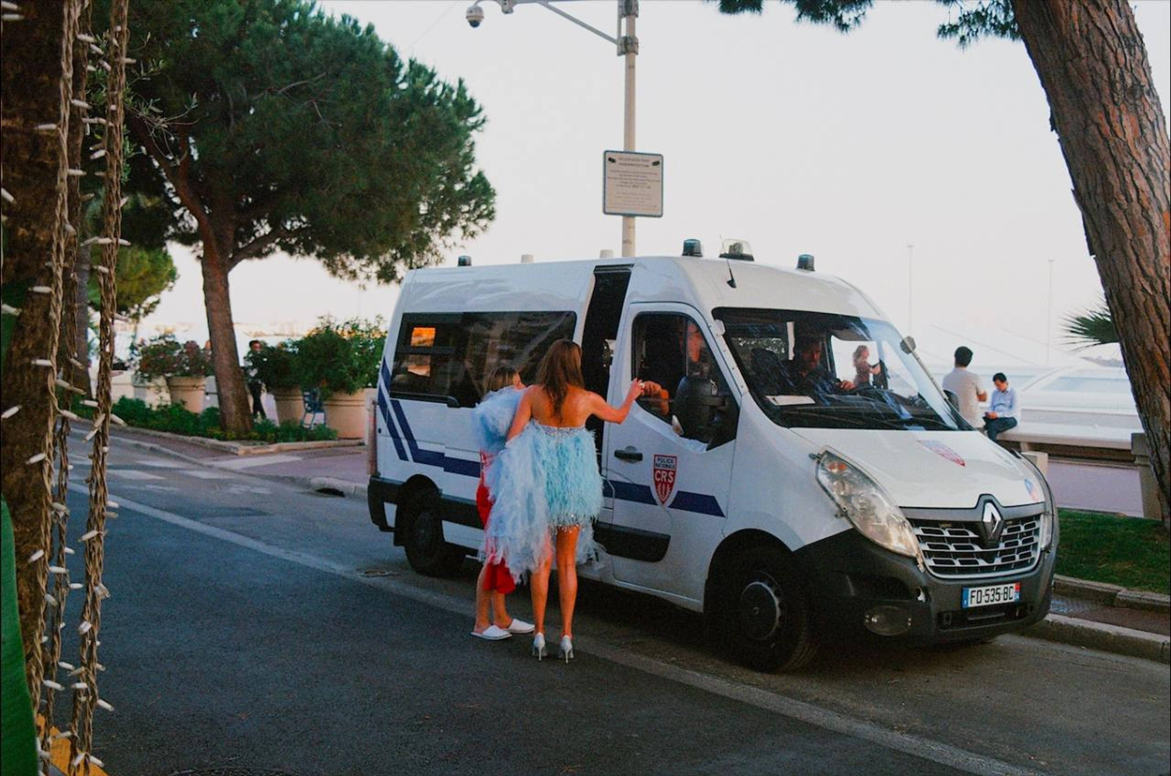 Seasonal visitors, assisted by local guardians of peace on the Boulevard de la Croisette.