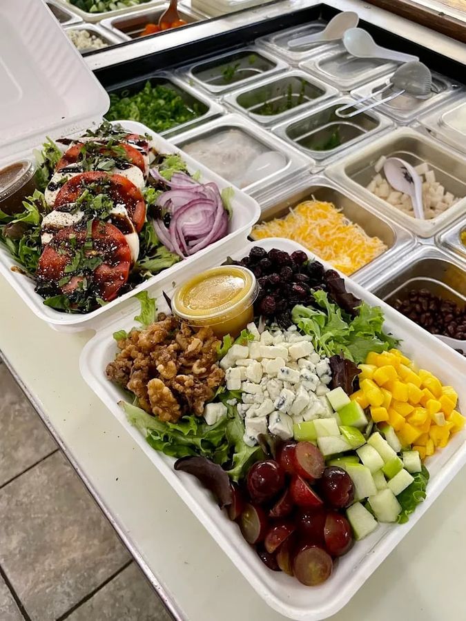 Fresh salad bowls prepared for corporate catering