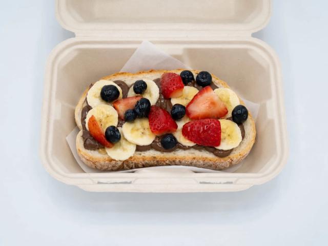 Dessert toast with banana, strawberry, blueberry, and chocolate at Aloha Salads