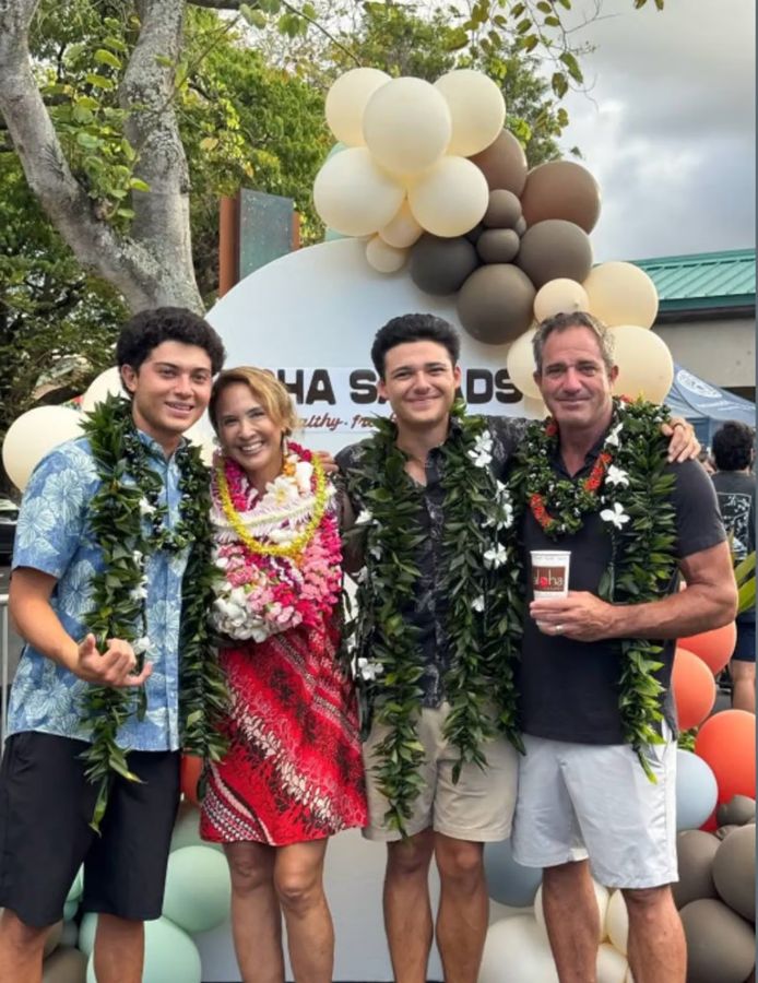 Sara Lufrano and family at the Aloha Salads grand opening, wearing leis