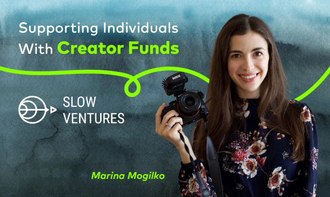Marina Mogilko is smiling as holding a camera in her hand.