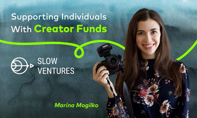 Marina Mogilko is smiling as holding a camera in her hand. 