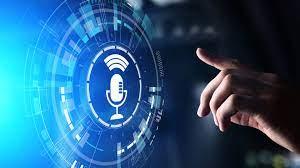 A person pointing their finger at a microphone icon on a futuristic screen. The microphone icon is glowing, suggesting it is active. 