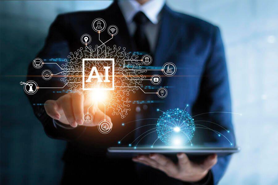 A businessperson in a suit holds a tablet displaying futuristic artificial intelligence (ai) technology graphics with icon connections and a glowing digital brain.