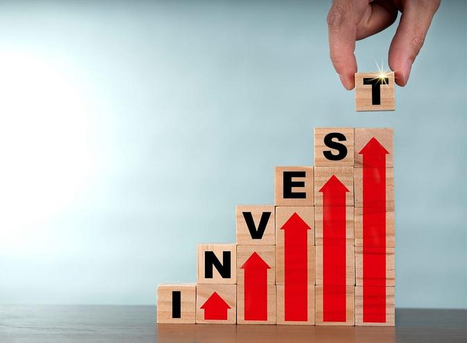 A person strategically arranges blocks with the word