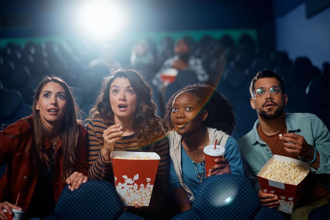 multiracial-group-of-friends-watching-suspenseful-2023-11-27-05-01-47-utc.jpg