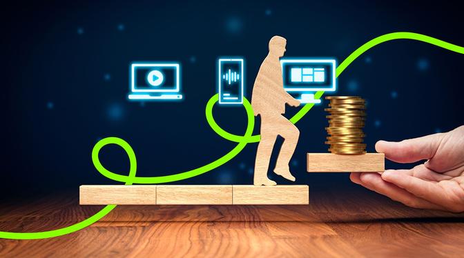 A businessman holds a stack of coins while a wooden figure walks on a wooden bridge.
