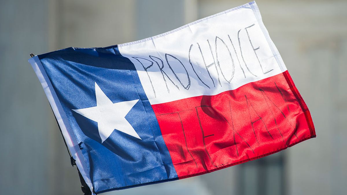 Pro-choice Texans written on a Texas flag