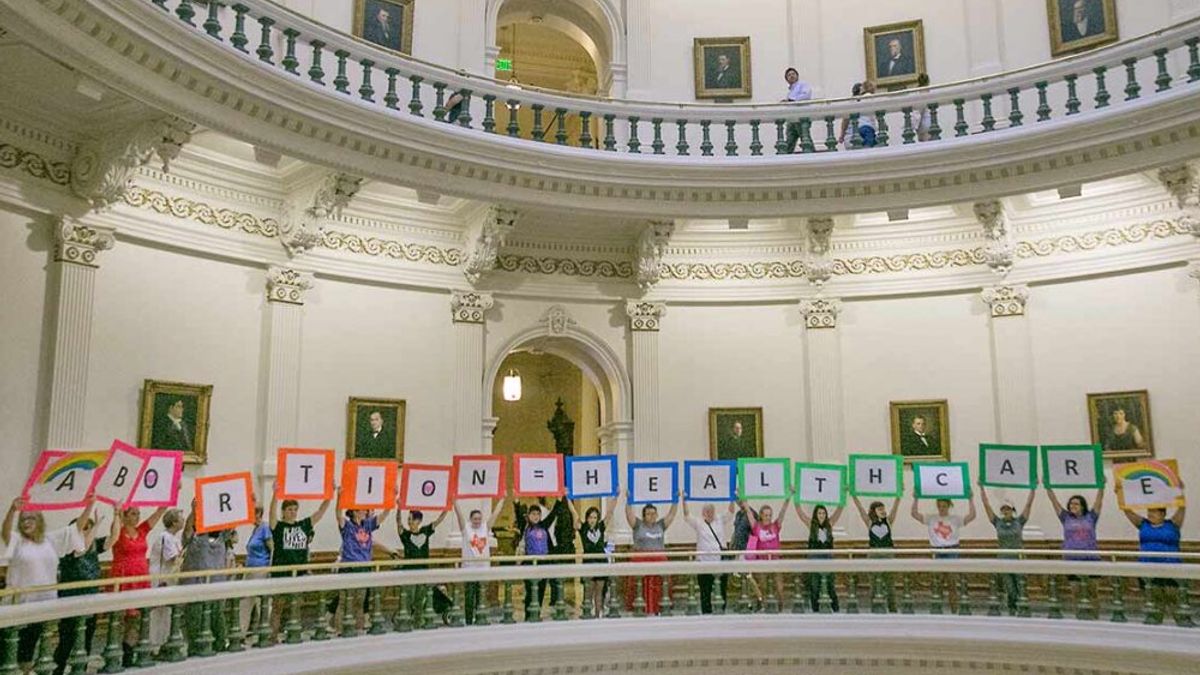 Reproductive freedom advocates gather at the rotunda at the Texas Capitol