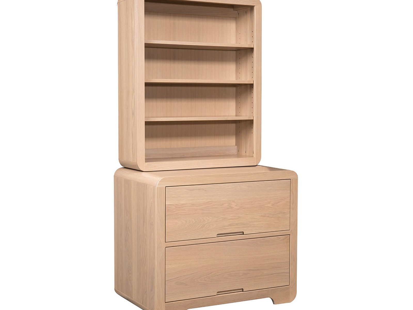 hand-rubbed finish hardwood Rounded Edge Bookcase With Two-drawer Base In Natural Wood, Rounded Edge Bookcase With Two-drawer Base In Natural Wood in a showroom vignette setting highlighting Rounded Edge Bookcase With Two-drawer Base In Natural Wood (frame 1 of 2).