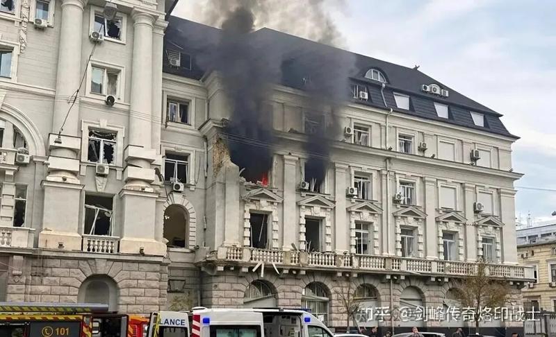 Black smoke pouring from an upper floor of a government building in Kyiv