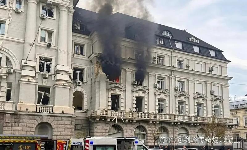 Black smoke pouring from an upper floor of a government building in Kyiv