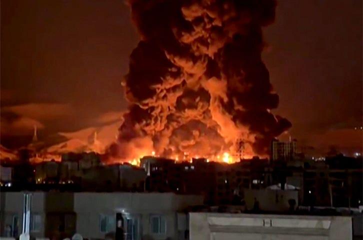 TEHRAN: A massive fireball erupts after an oil depot was targeted by US-Israeli bombing. The destruction of refineries and storage facilities in Iran’s capital precipitated a toxic ‘oil rain’ over the city, with skies darkened by thick black smoke.—AFP