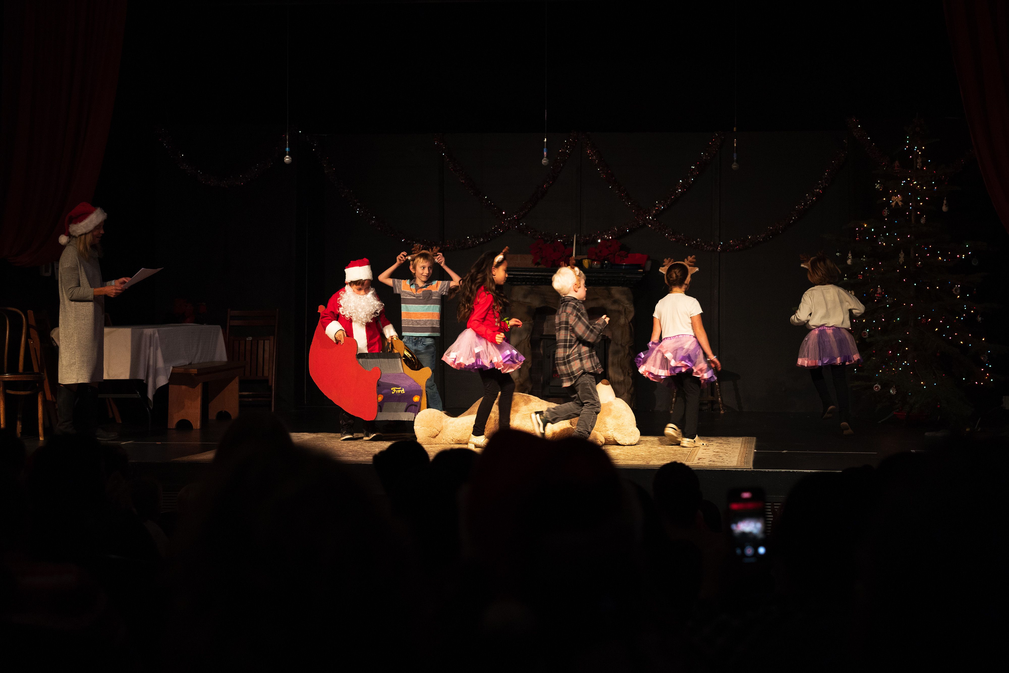 Santa’s sleigh is pulled by his reindeer in Ms. Edwards’ 2nd and 3rd grade play