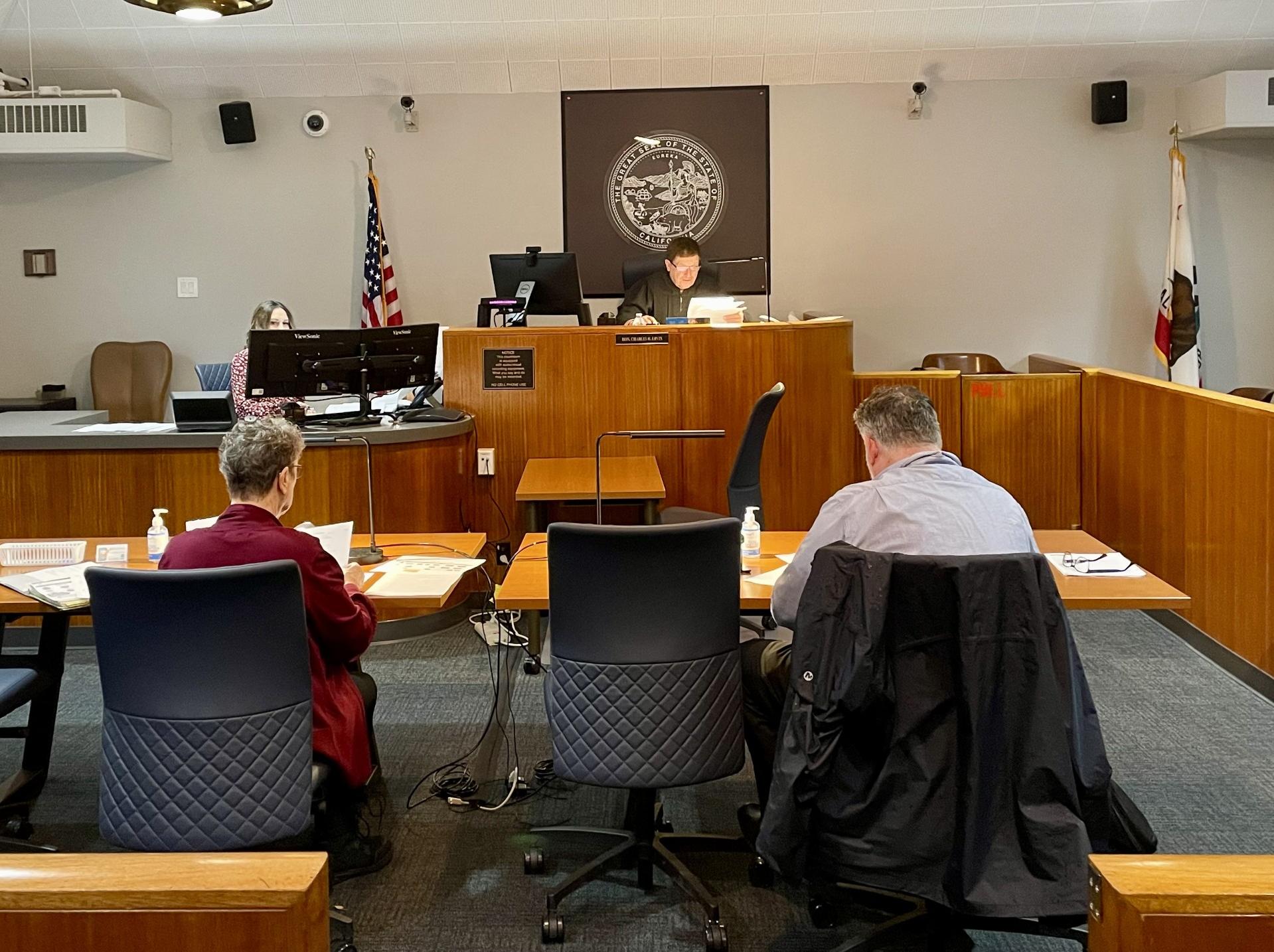 Family Law Facilitator Ingrid Larson and Scott McLeran, Deputy County Counsel executing a mock trial of CARE Court with Judge Charles H. Ervin and supervising court clerk, Tosha Prince.