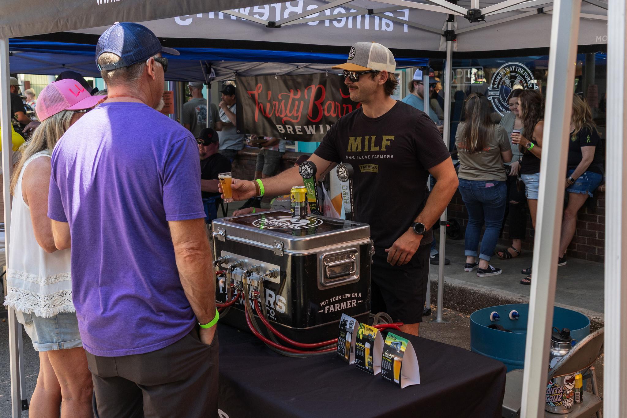 A Farmers Brewing Co. sample is distributed.