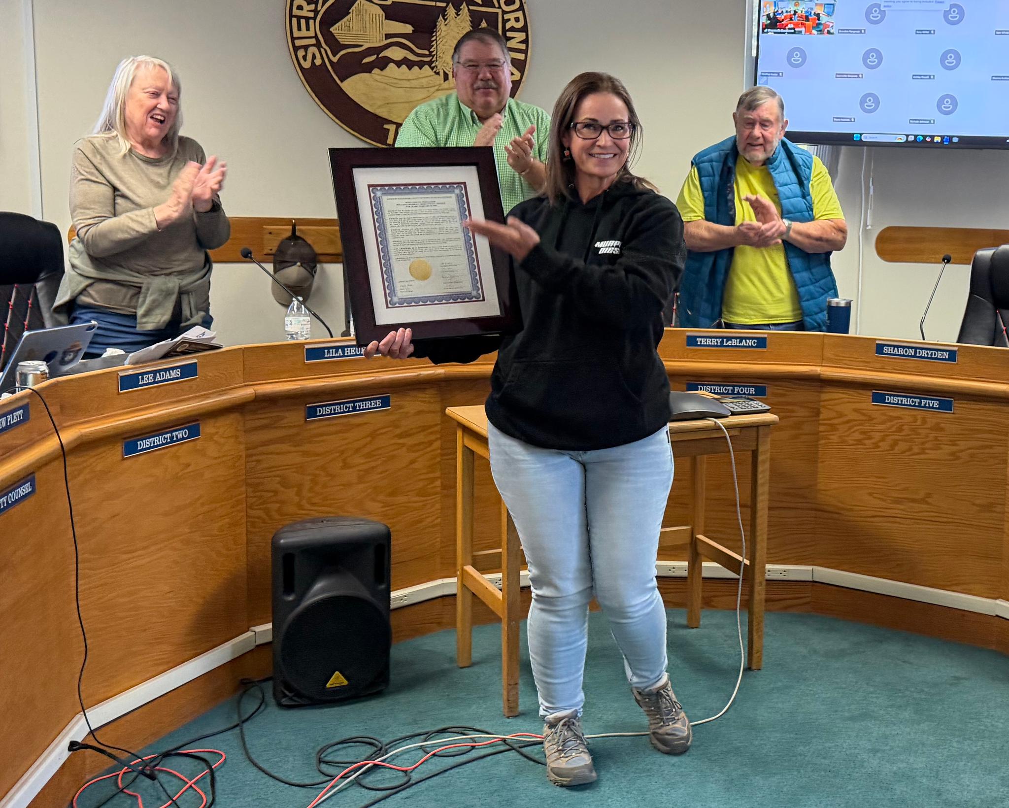 Marshall accepts the Resolution of Appreciation presented to her by the Sierra County Board of Supervisors.