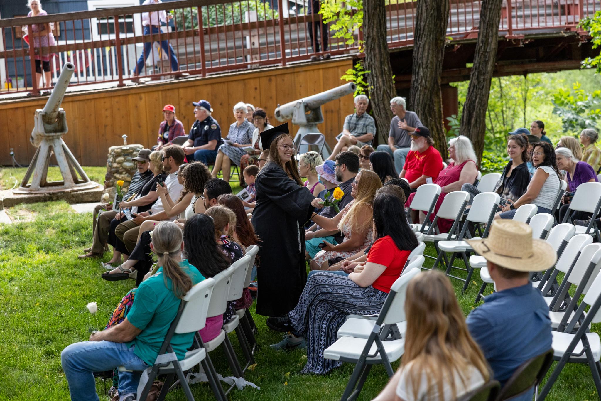 Natalie Rust gives a symbolic flower to her mother
