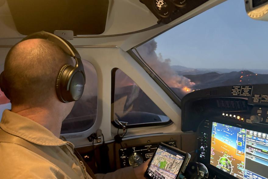 Dave Mundwiler, a lead plane pilot, during a recent mission in the lead wildfire response plane. Credit: David Mundwiler, U.S. Forest Service.