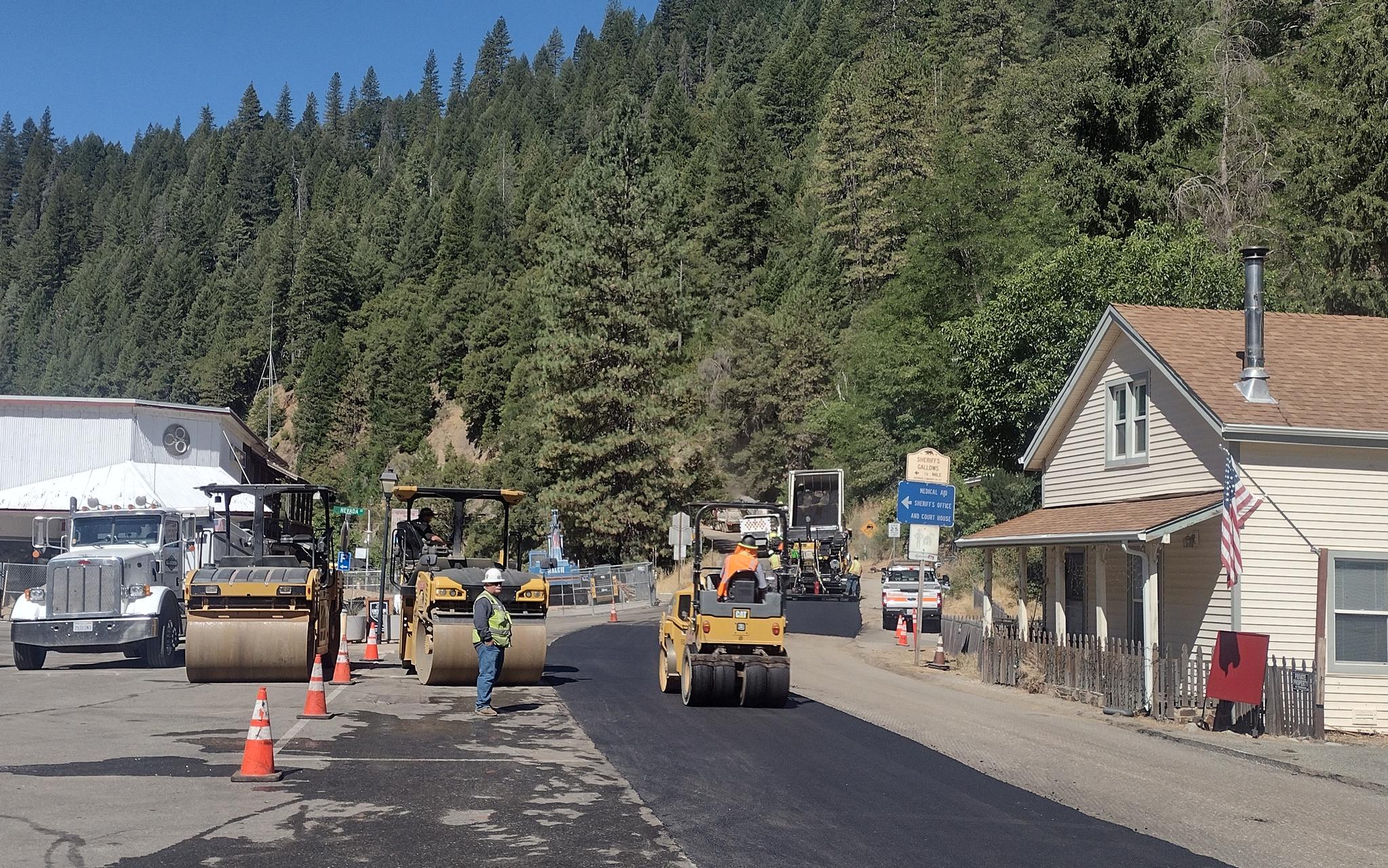 The Caltrans crew paves next to the Two Rivers parking lot