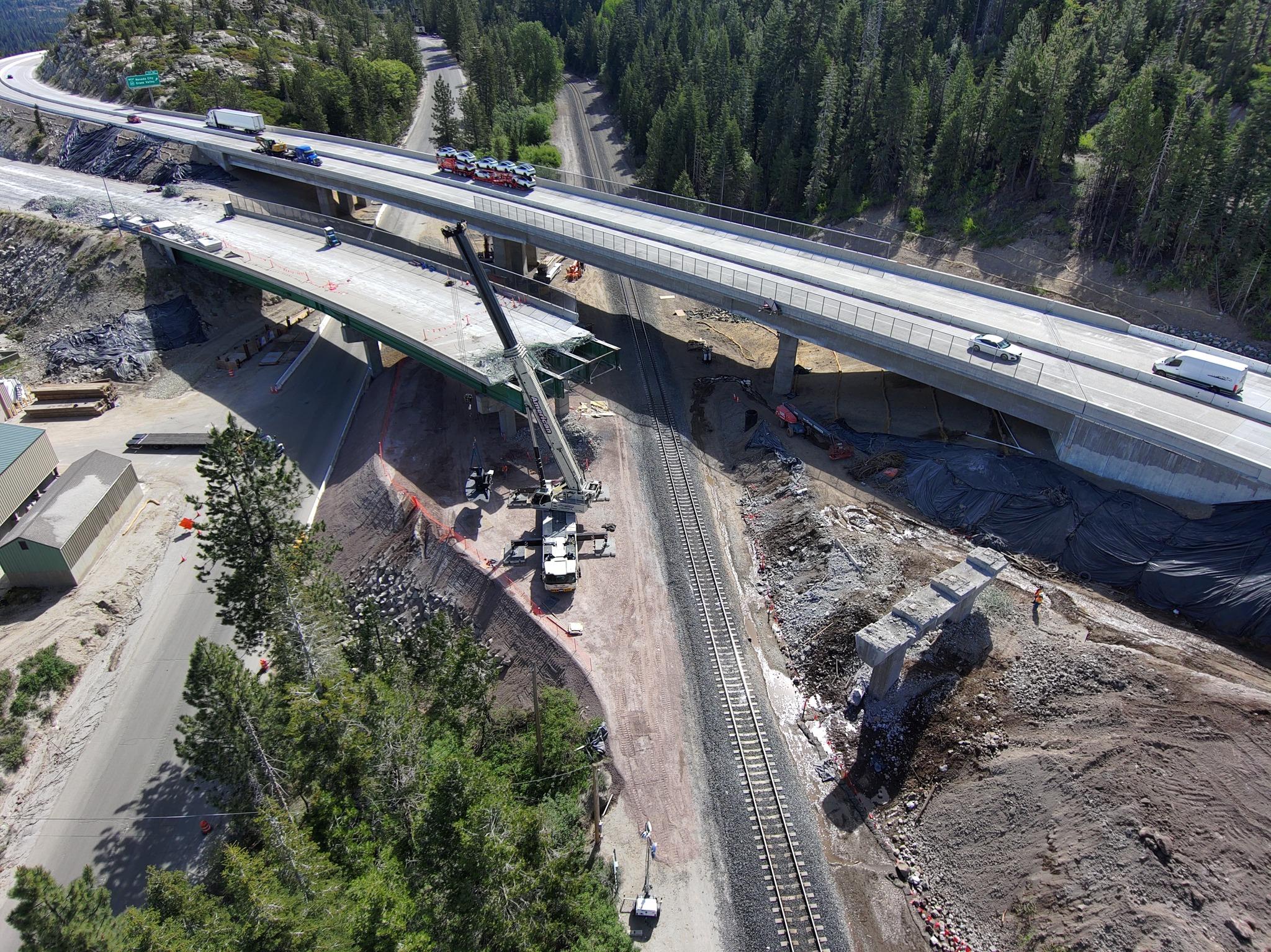 The partially demolished old I-80 bridge (next to its newly constructed replacement) over SR-20 in Nevada County. Credit: Caltrans District 3.
