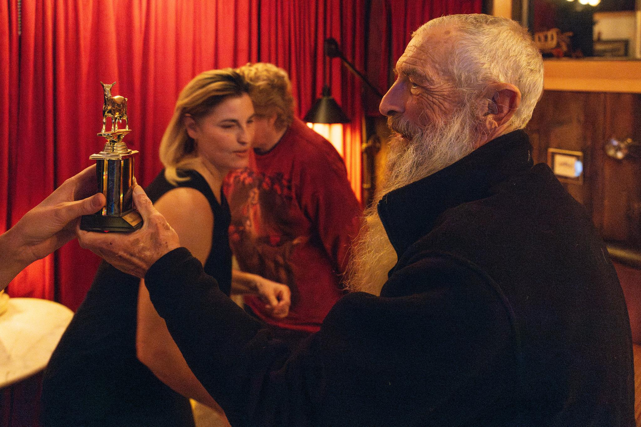 Carl receives his first-place goat trophy.