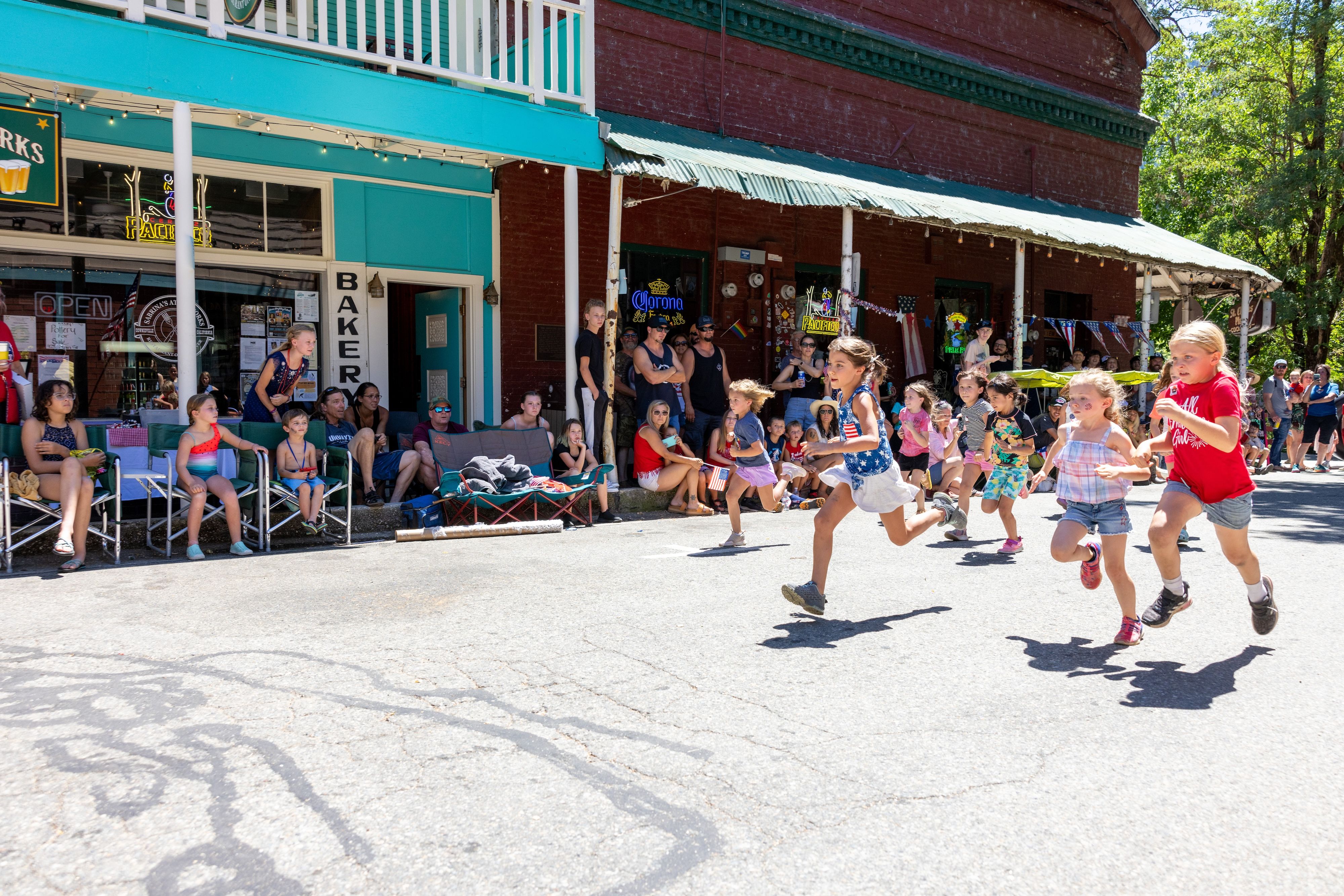 Camby Corda leads the pack as the 7-year-old girls race to the line