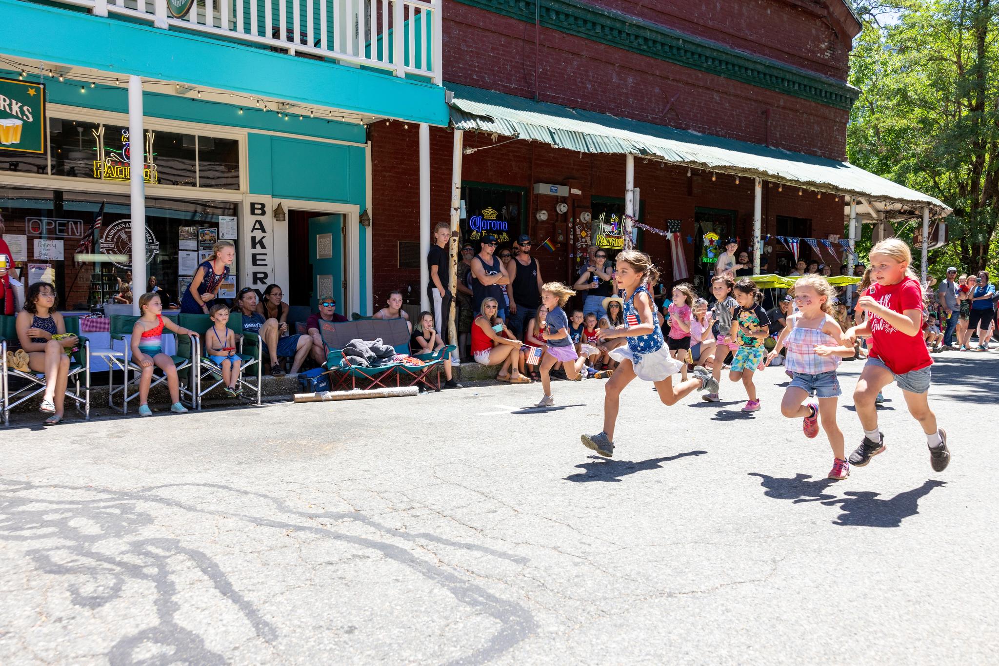 Camby Corda leads the pack as the 7-year-old girls race to the line