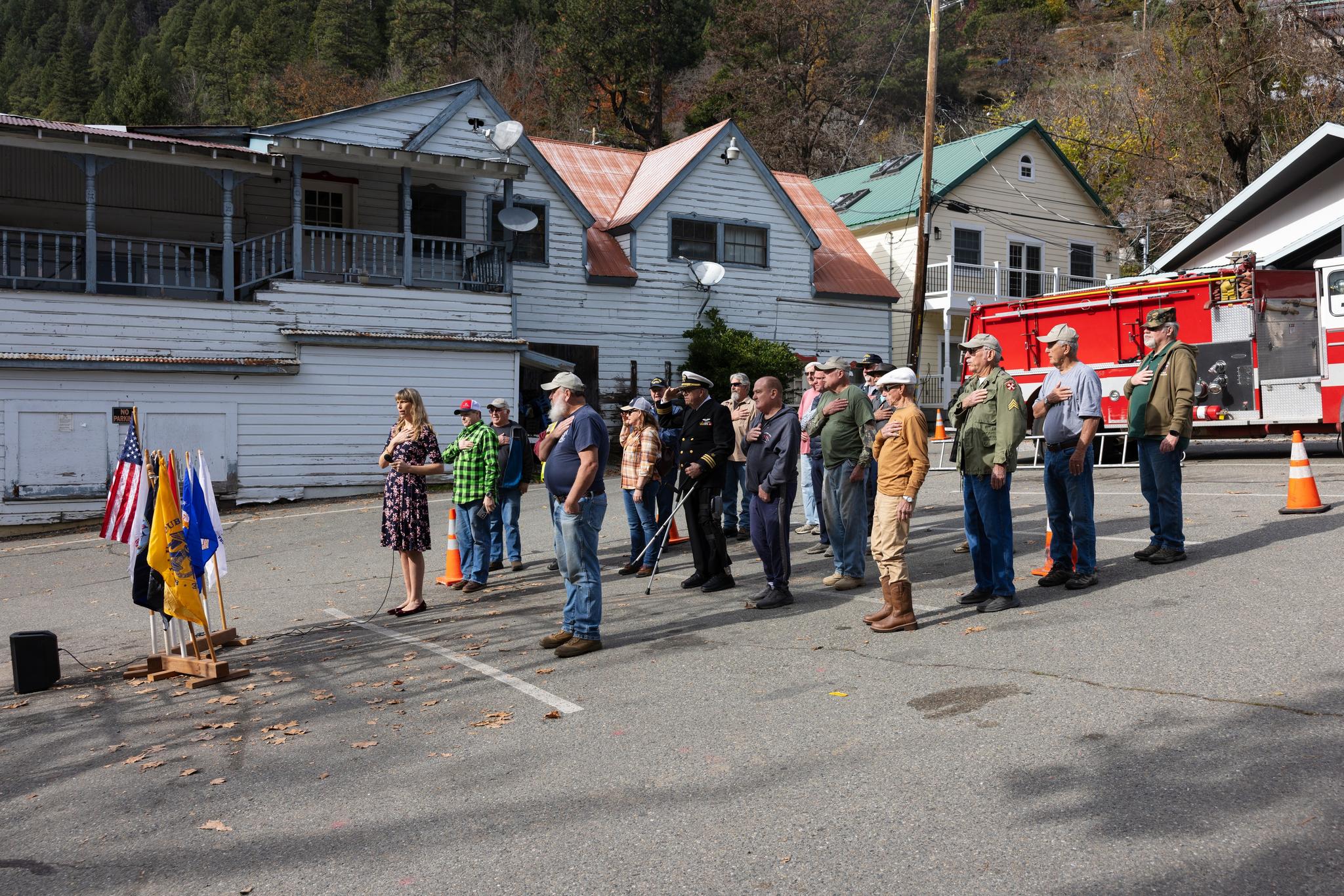 Veterans give the Pledge of Allegiance at the Downieville Bell Tower.