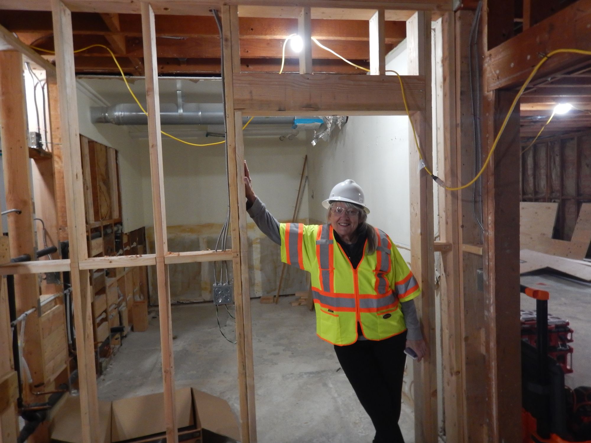 Supervisor Heuer in the demolished interior of the Downieville Community Center. Photo by Billy Epps