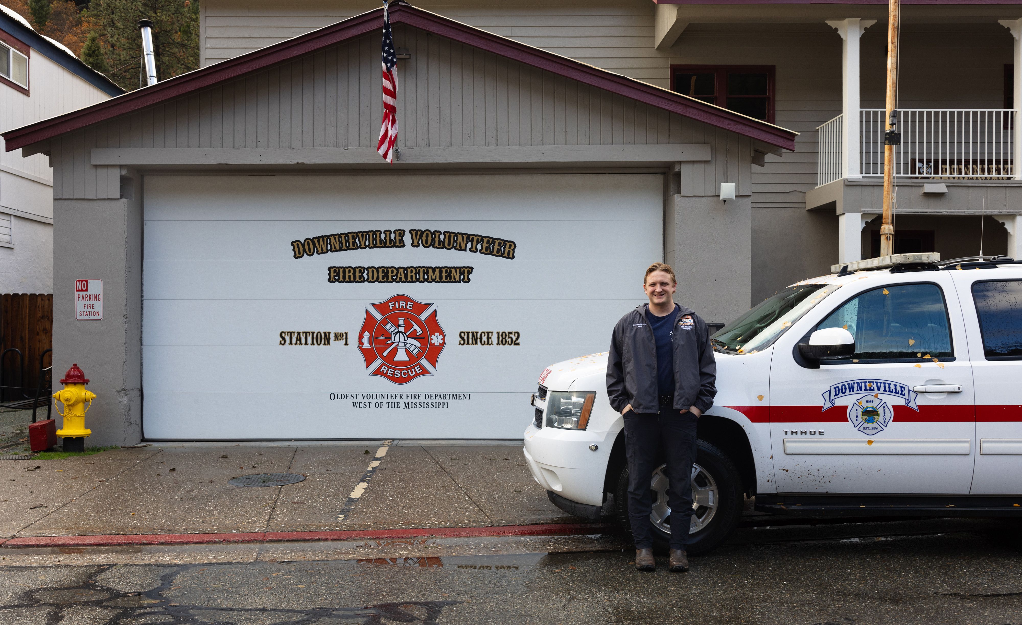 Course instructor Tegan Harrington in front of his EMS vehicle at the Downieville Fire Station