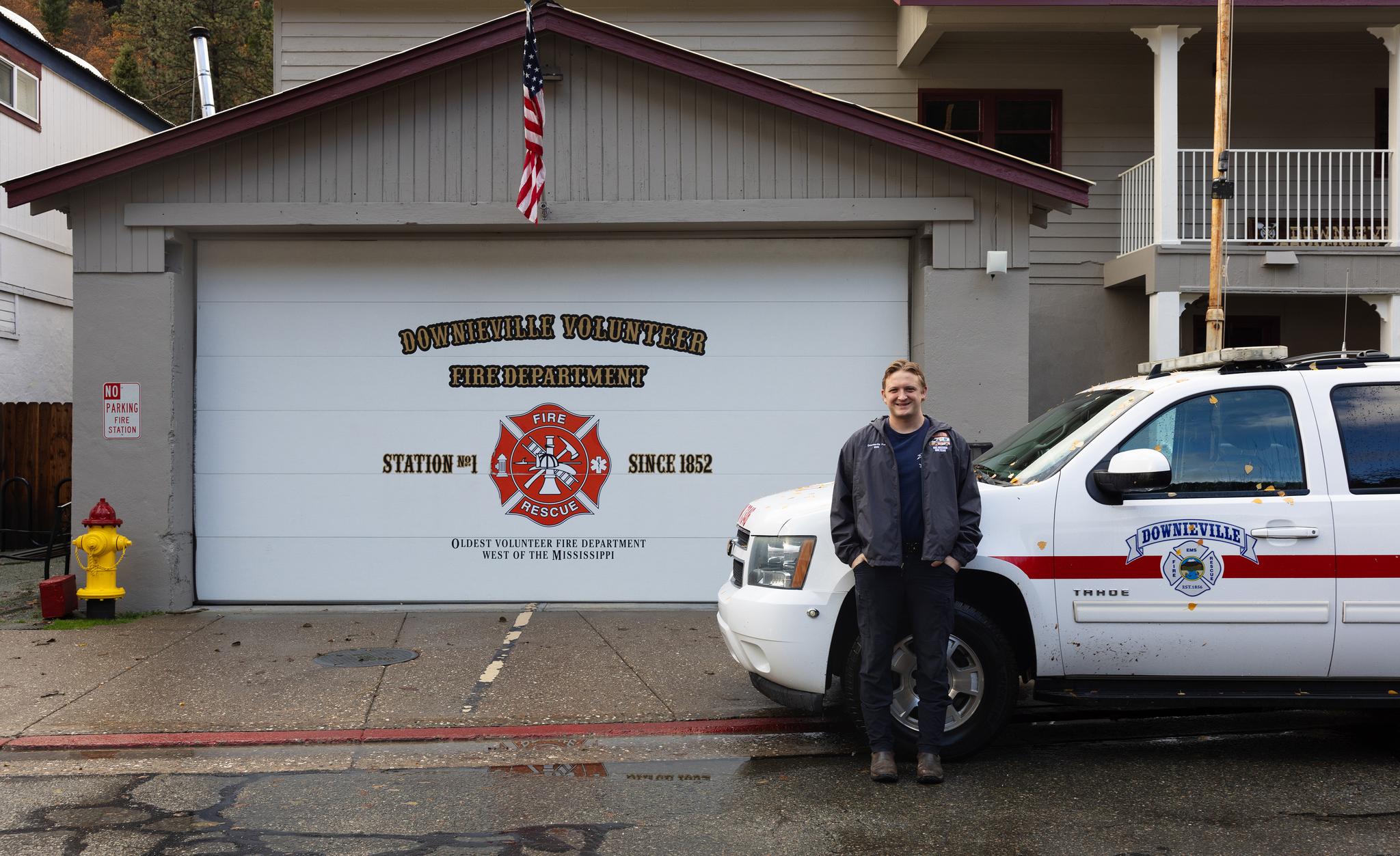 Course instructor Tegan Harrington in front of his EMS vehicle at the Downieville Fire Station