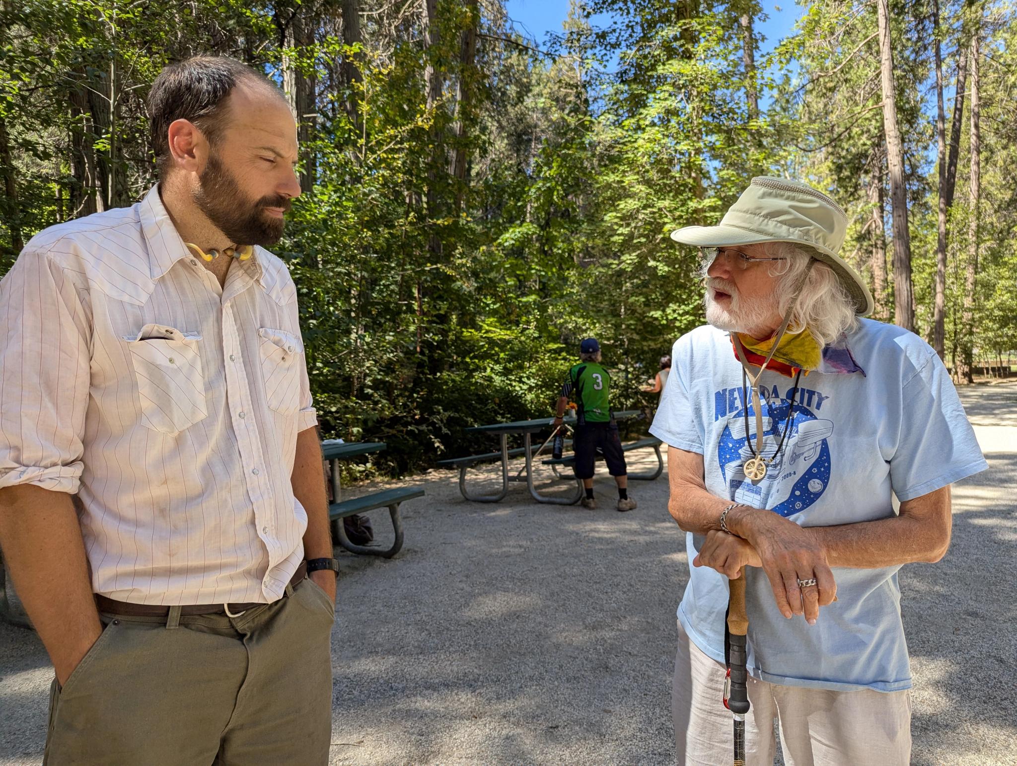 Grass Valley City Councilman Tom Ivy (left) and Homeless Advocate Tom Durkin exchange views at Sierra Roots luncheon in Nevada City.
