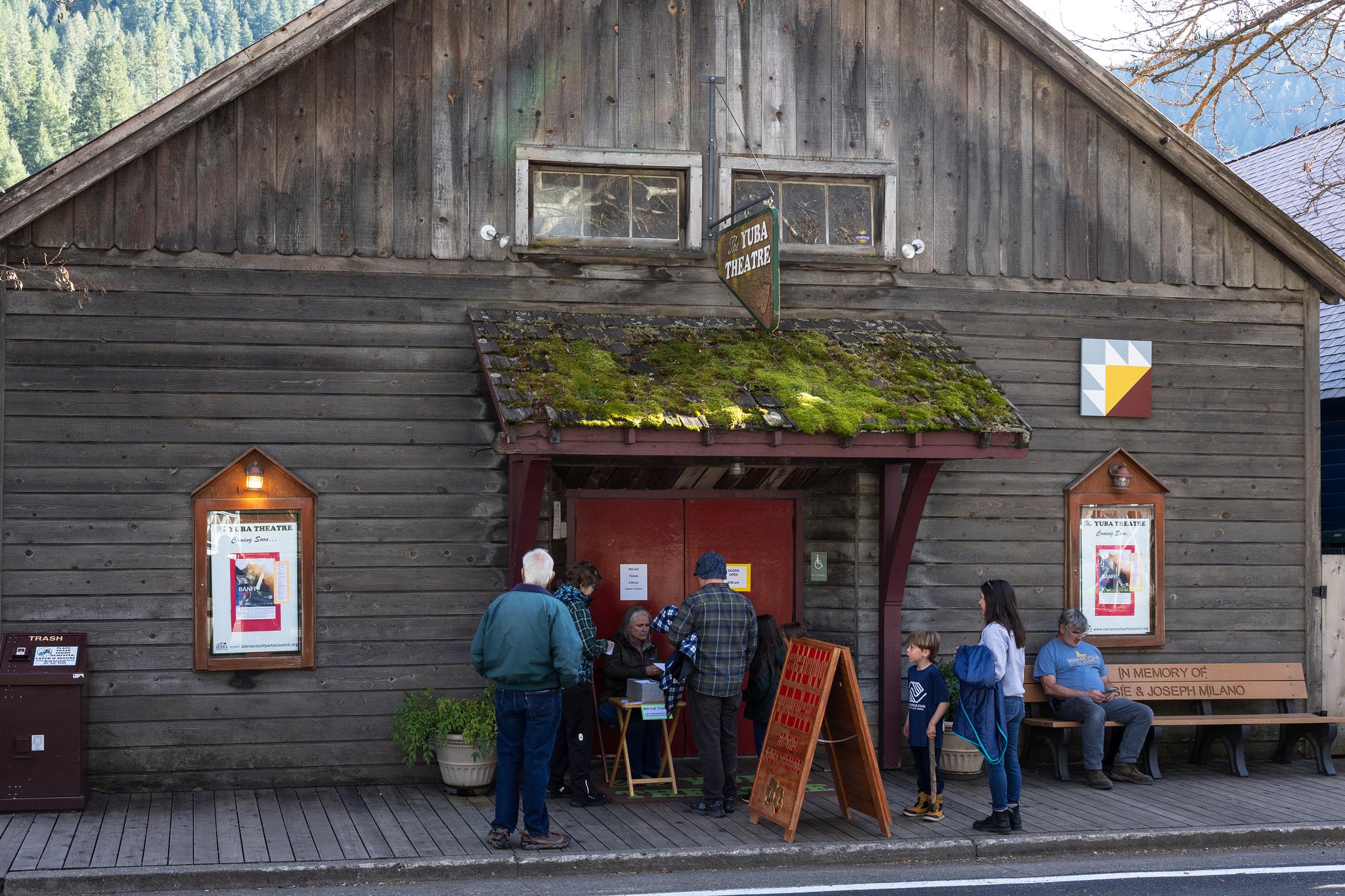 Volunteer Kristie Pearmund distributes tickets ahead of the Friday screening.