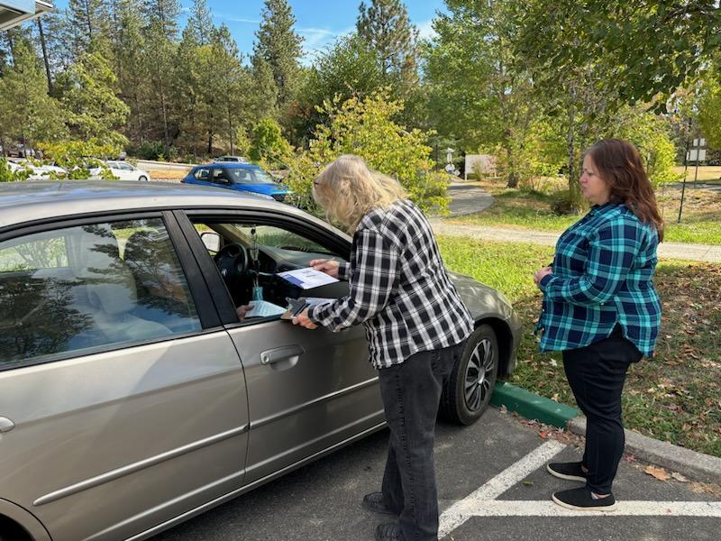 Nevada County Elections Department staffer Myra Davies-Easley offers gracious, knowledgeable help to a voter needing curbside help.