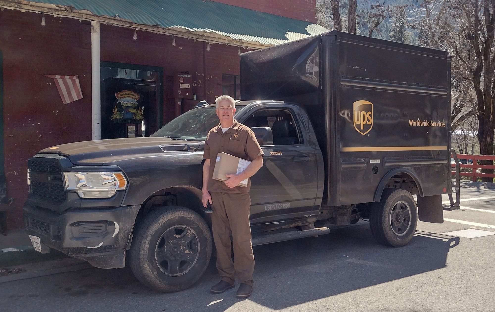 UPS driver Garitt Cox delivers to Downieville