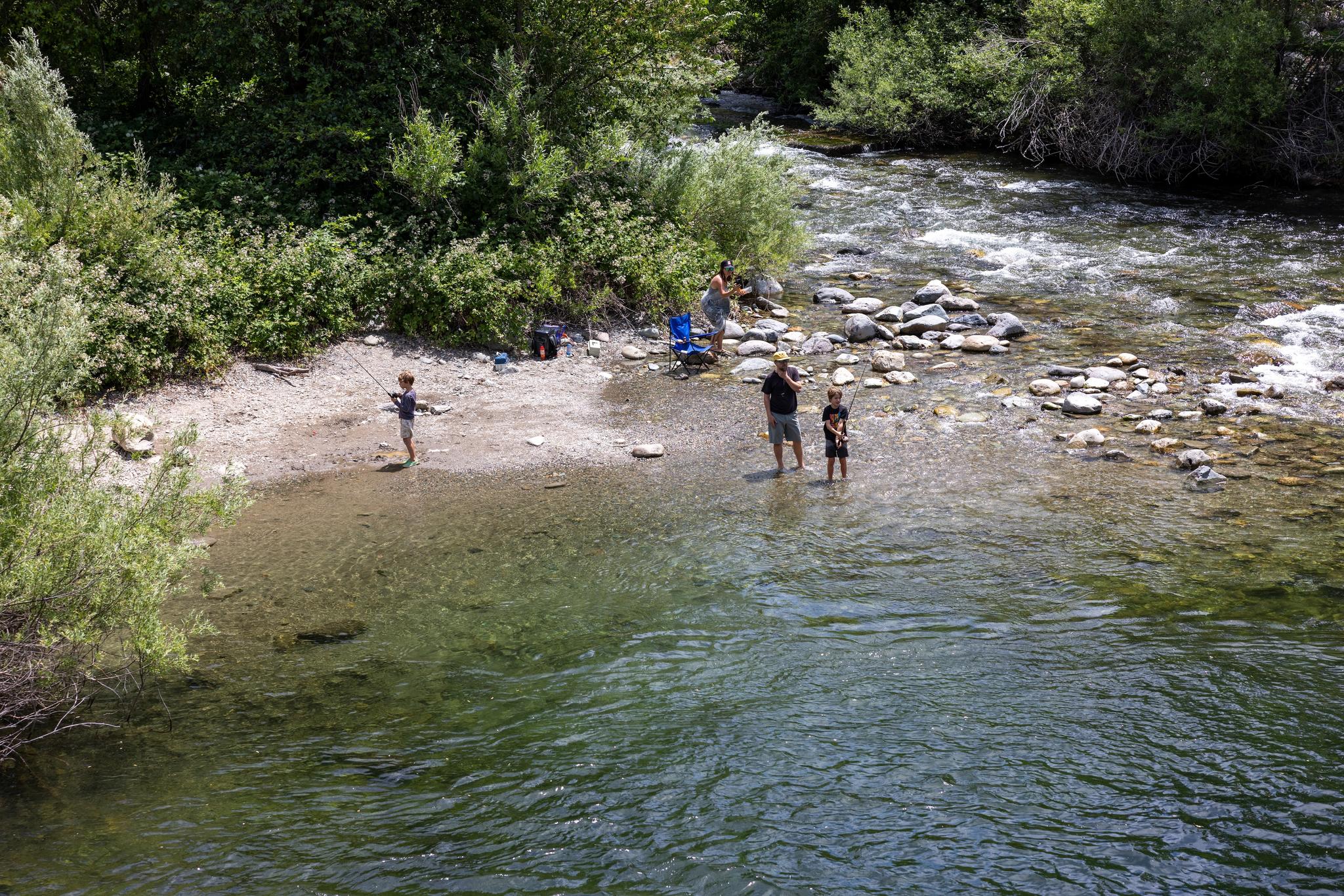 Children fish at the Downie / Yuba River Confluence in Downieville