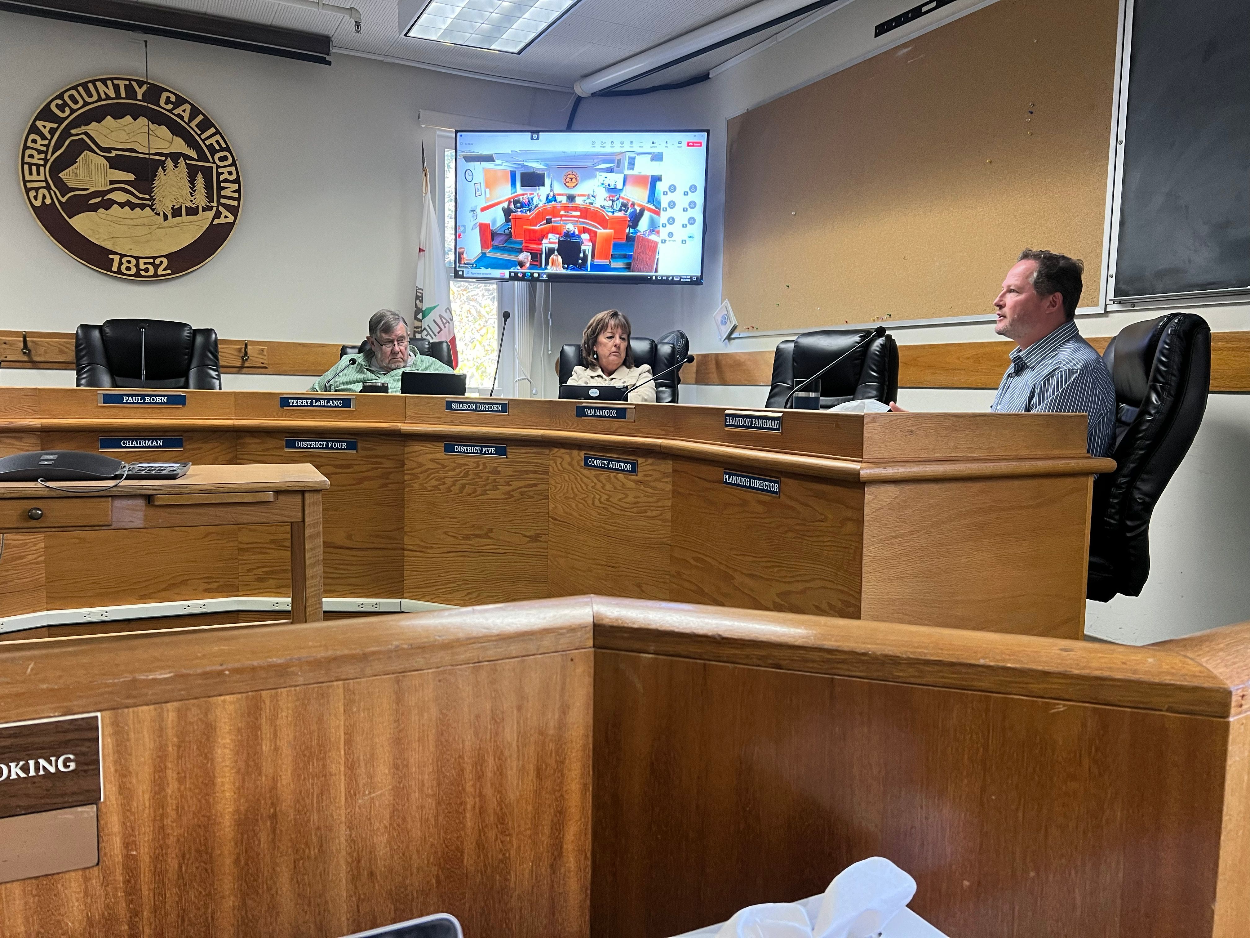 Planning Director Brandon Pangman explains changes made in the STR ordinance revision to Board members, including Terry LeBlanc (left) and Sharon Dryden (middle)