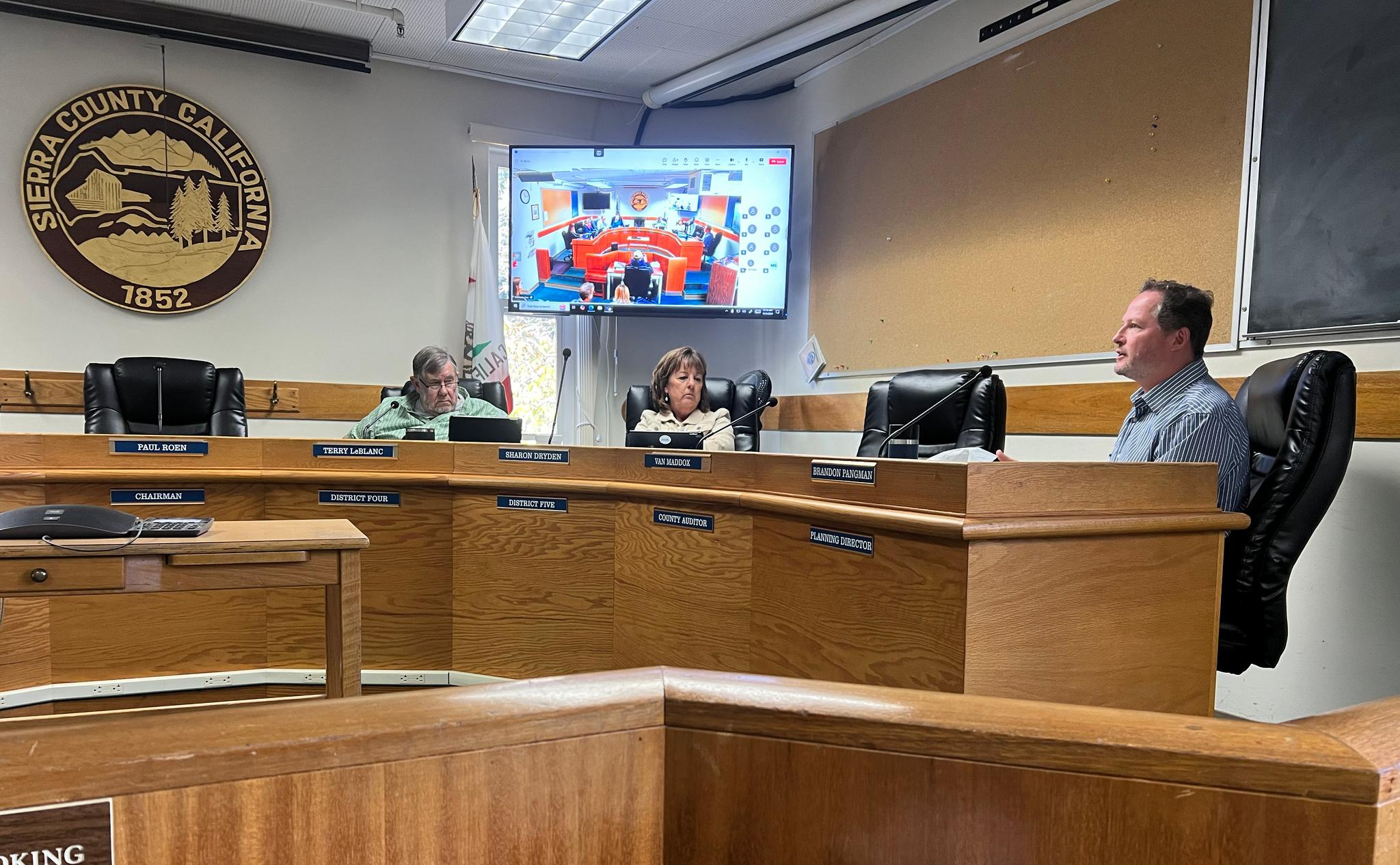 Planning Director Brandon Pangman explains changes made in the STR ordinance revision to Board members, including Terry LeBlanc (left) and Sharon Dryden (middle)