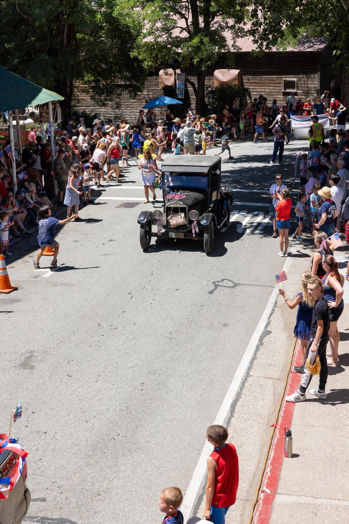 Supervisor Lee Adams drives his car representing the Downieville Museum