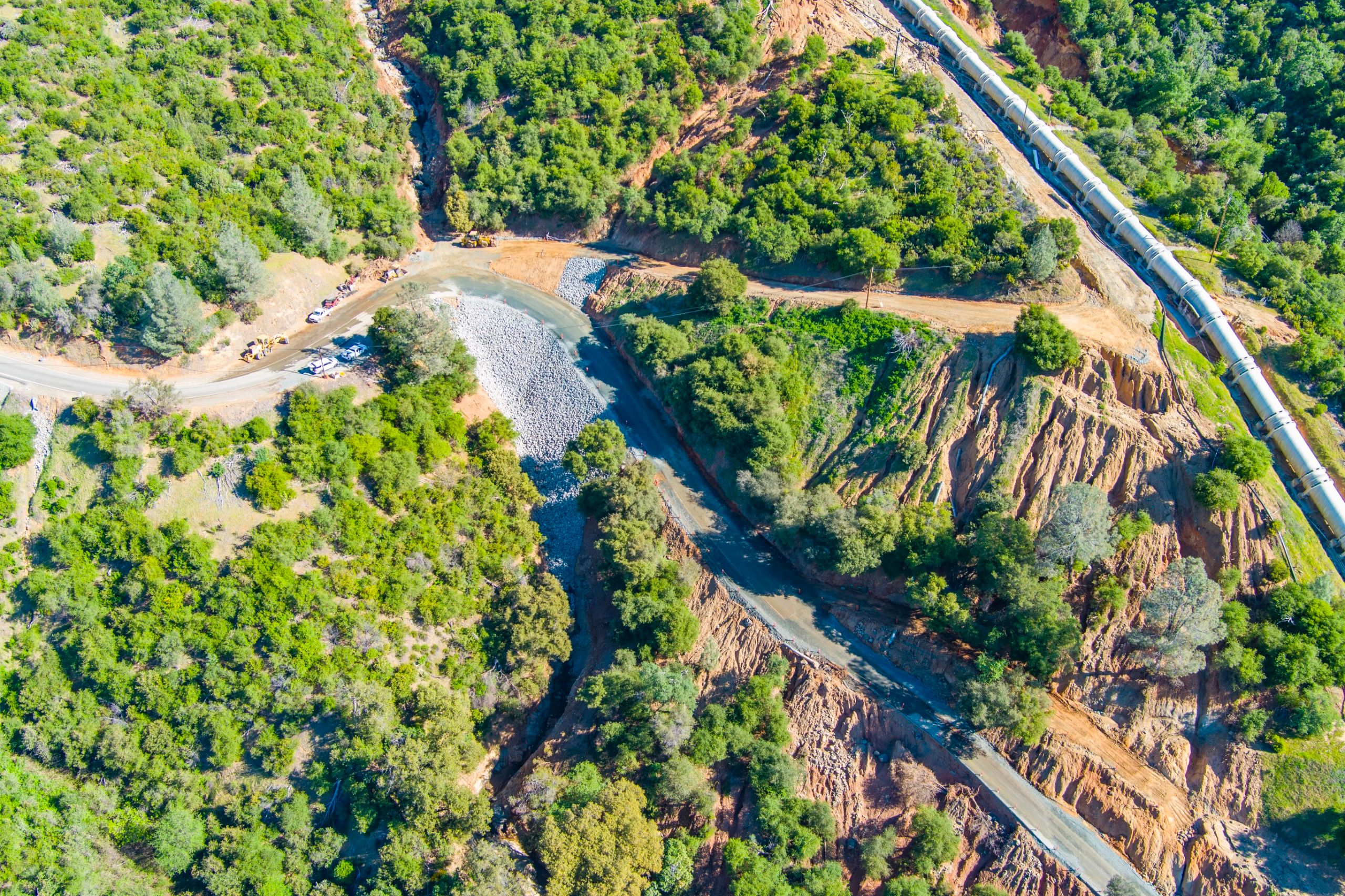 Repairs continue on Lake Francis Road, including reinforcing washed-out sections, installing drainage culverts, and paving. The road remains closed beyond the last residence. Photo: Alex Boesch/Yuba Water Agency.
