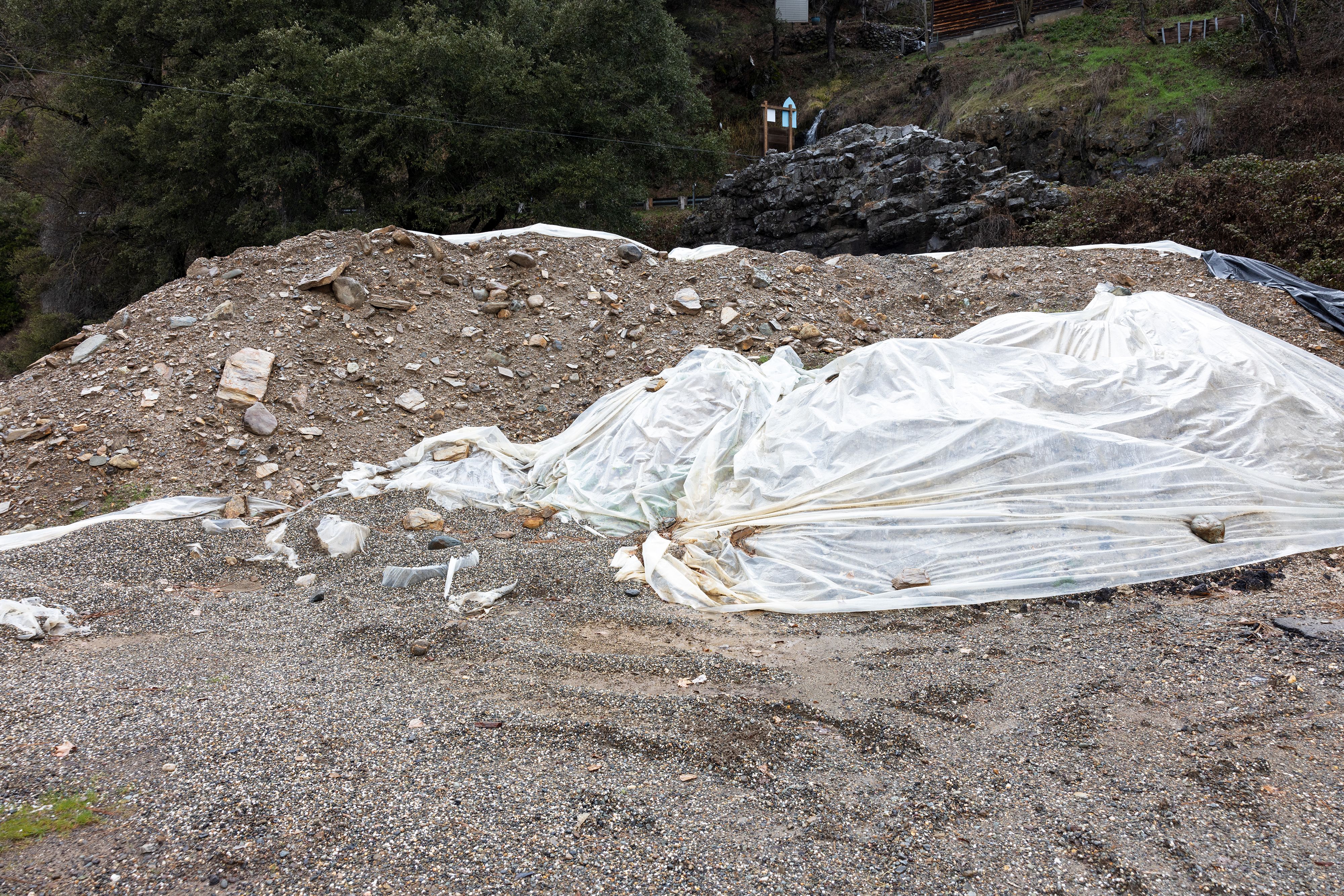 This dirt pile behind the Downieville Gas Station is deemed contaminated and must be hauled away before the station can be reopened to the public.