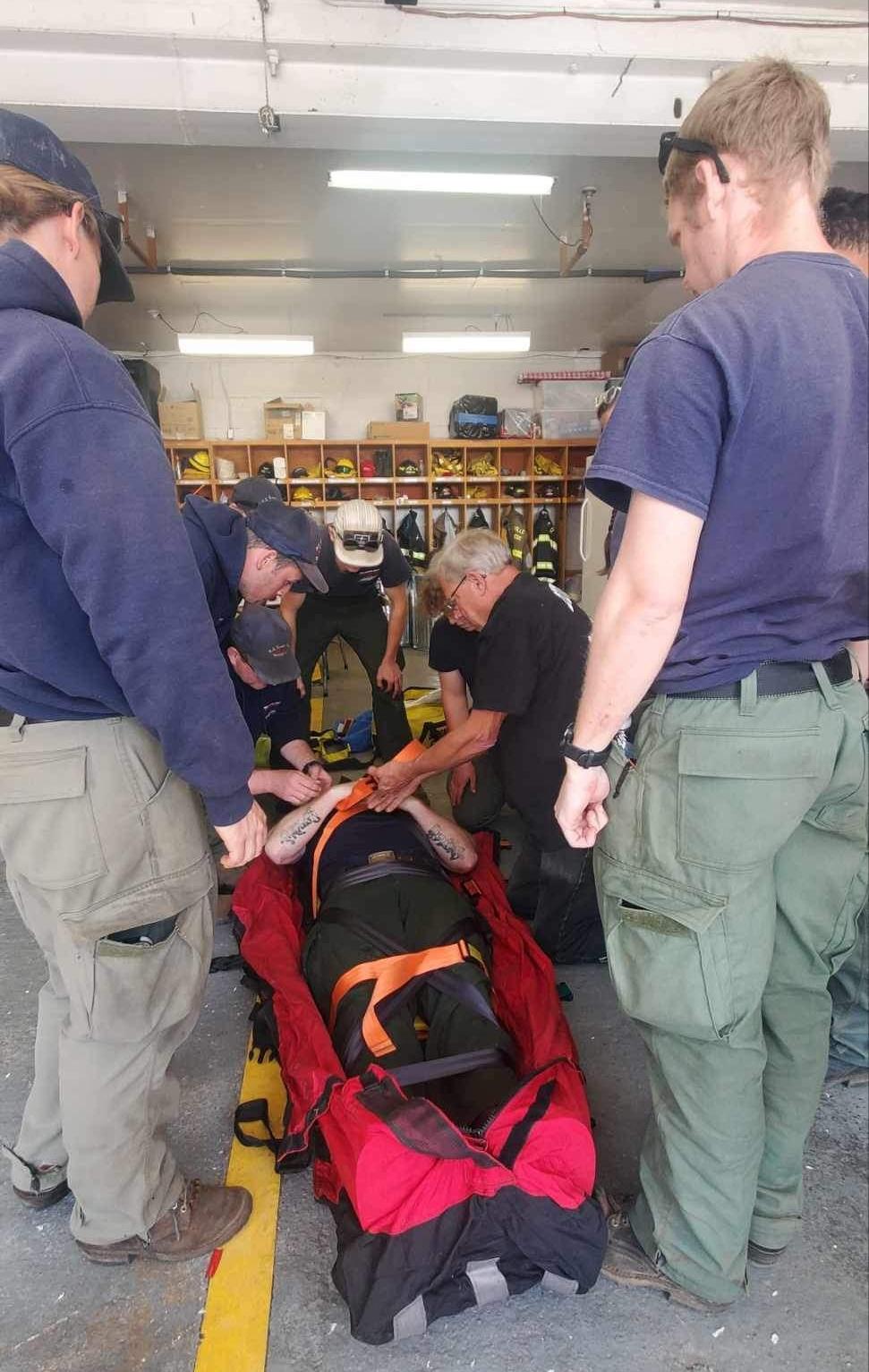 Steve Folsom demonstrates securing a patient in a Bauman Bag