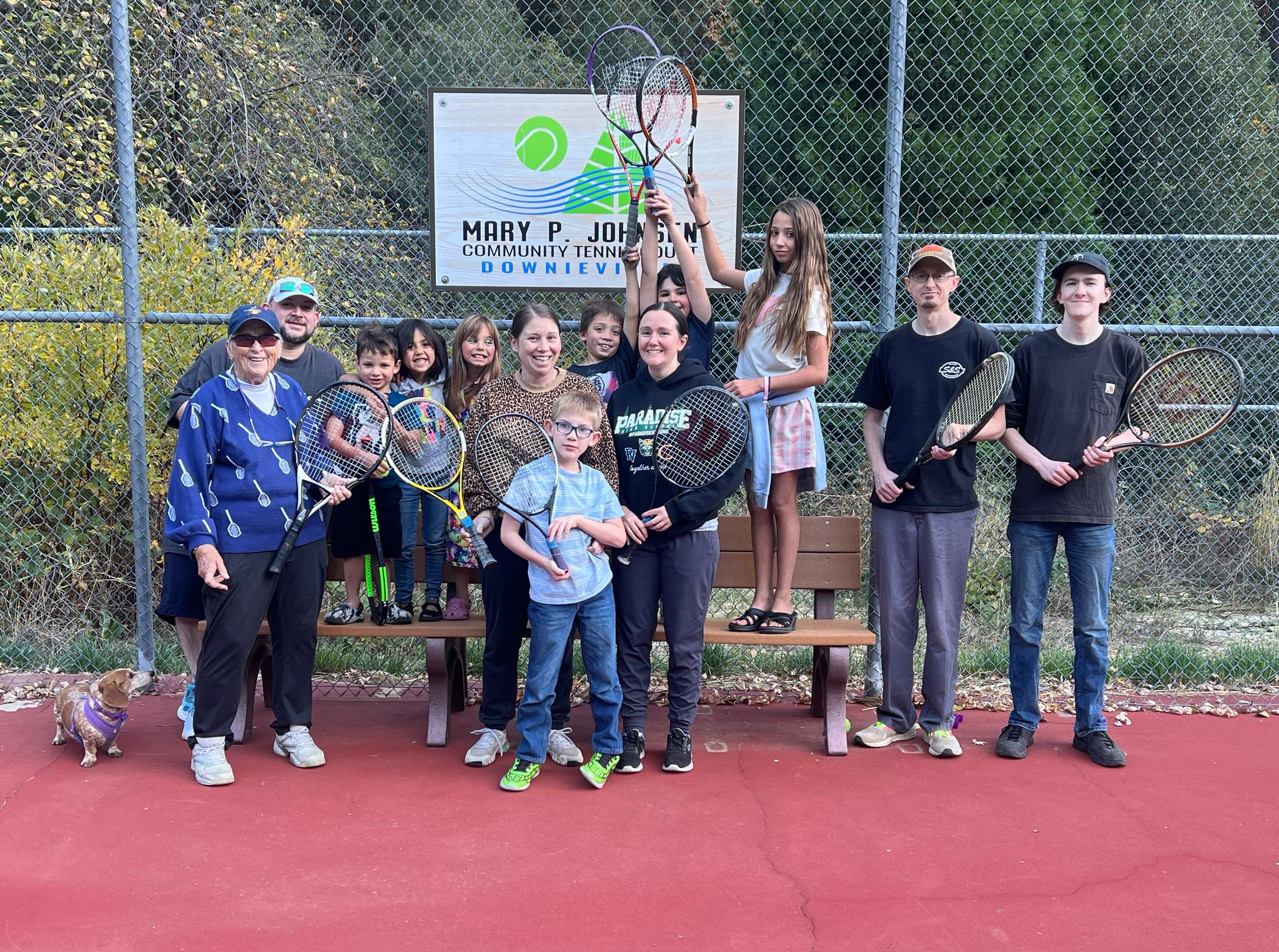 Tennis Clinic participants gather at the Mary P. Johnsen (left) Community Tennis Court in Downieville