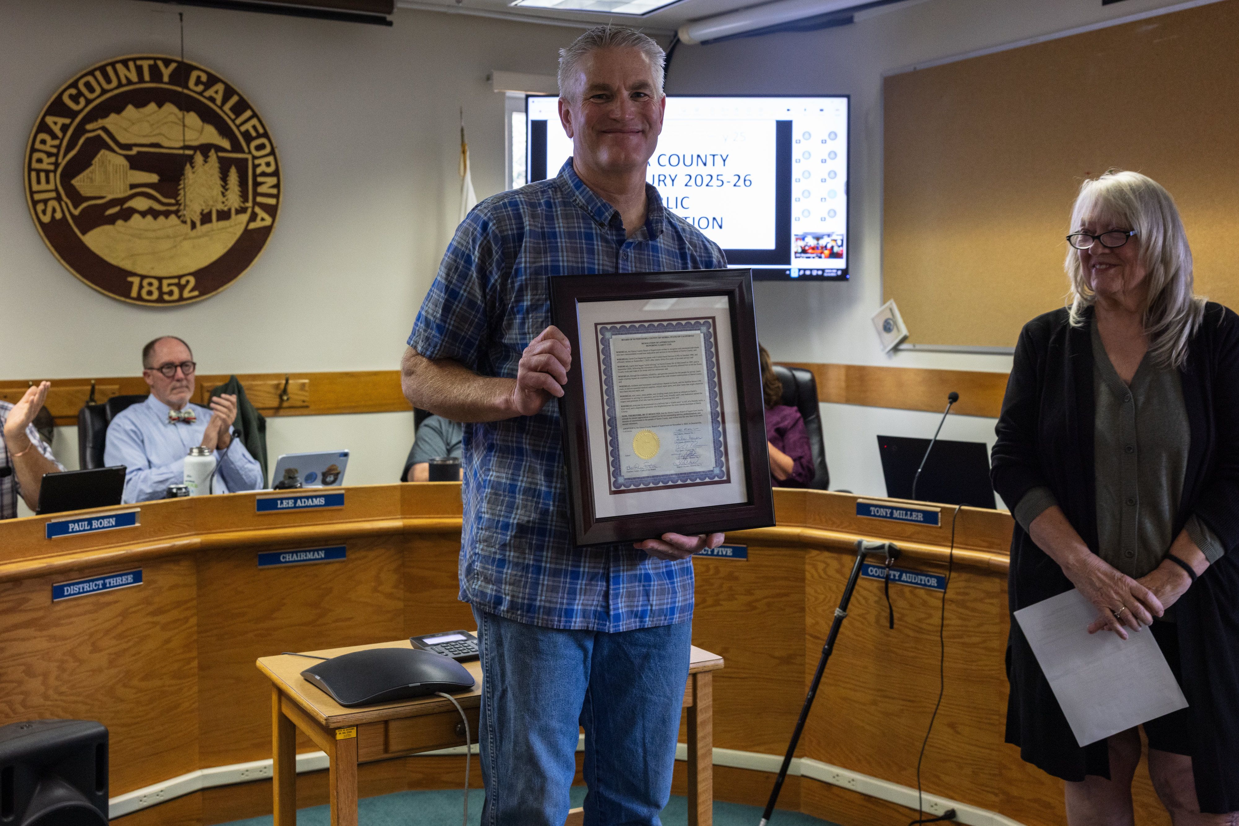 Garitt with his Resolution of Appreciation at Tuesday’s meeting.