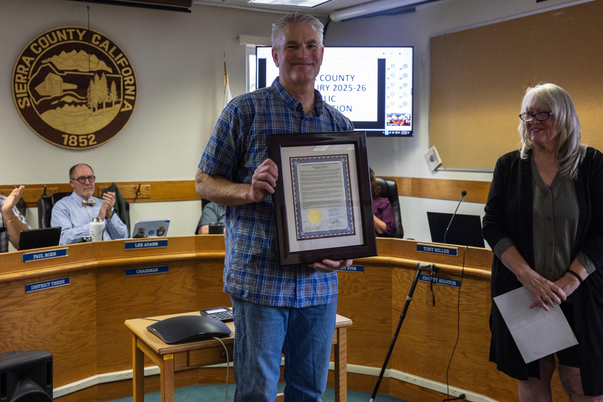 Garitt with his Resolution of Appreciation at Tuesday’s meeting.