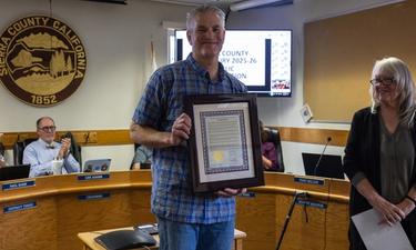 Community Supports UPS Driver Garitt Cox in Board Presentation
