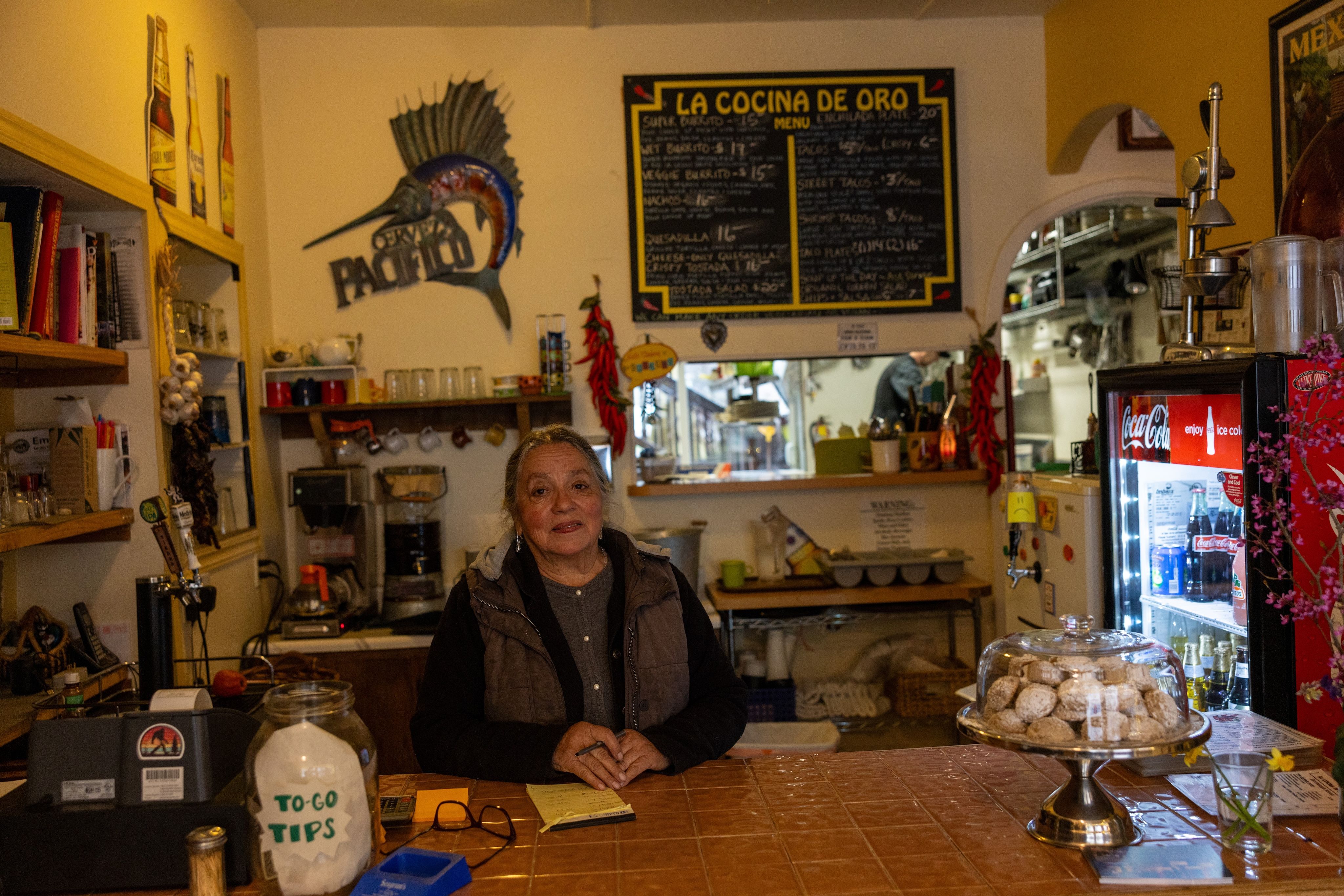 Feather Ortiz at the counter of La Cocina de Oro
