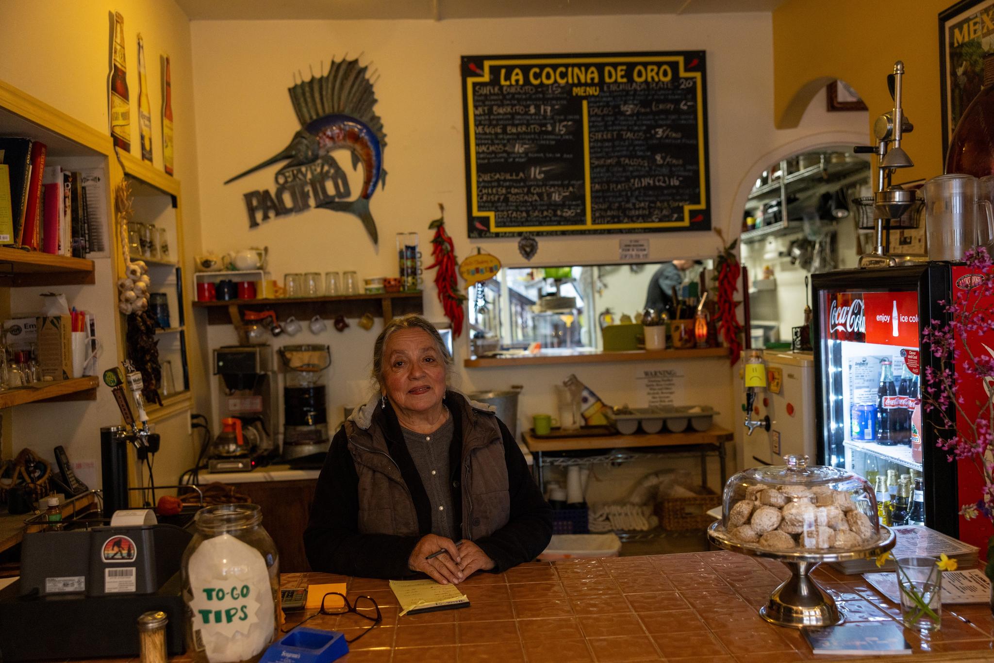 Feather Ortiz at the counter of La Cocina de Oro