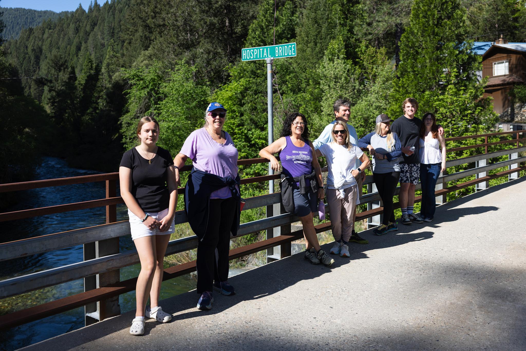 Walkers take a break on hospital bridge before continuing to Lavezzola Road.